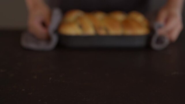 Freshly baked sweet bread with chocolate chips inside a black baking pan. Delicious homemade dessert