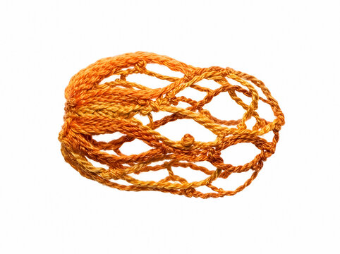 Orange twisted rope or twine coiled in loose knot formation, isolated on white background