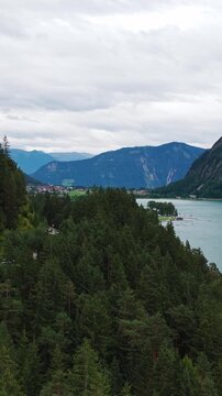 Aerial Tilt Up Establishing Waterfront Road Traffic Lake Achensee Austria Landscape, Vertical View