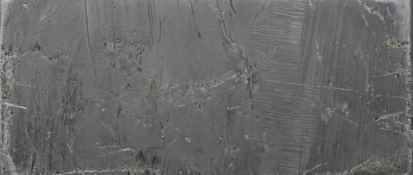 Dark anodized aluminum metal texture close up. Scratched and brushed metallic surface for background and design