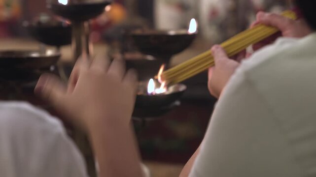 A Man Mo temple, or Man Mo Miu. People light candles and incense, recite prayers, bring offerings, and ask the gods for help.