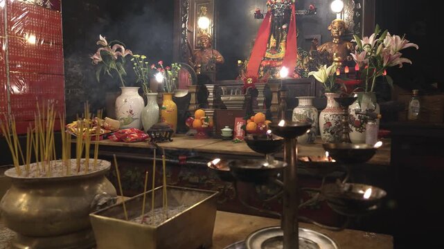 A Man Mo temple, or Man Mo Miu. People light candles and incense, recite prayers, bring offerings, and ask the gods for help.