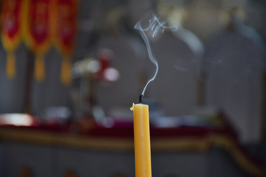 Burnt out candle closeup in a church