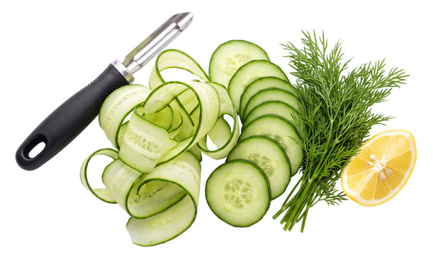 fresh cucumber ribbons dill lemon and peeler for salad preparation