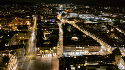 Fototapeta premium Drone aerial night panorama over Bundesplatz and illuminated Old Town streets in Bern, Switzerland
