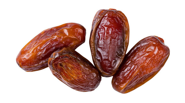 Four whole dried brown sweet date fruits