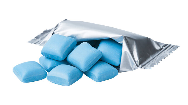 Blue square chewing gum pieces spilling from a silver metallic foil wrapper