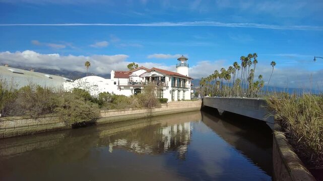 View of Mission Creek from State Street looking towards Cabrillo Blvd. in Santa Barbara, California on a sunny blue skies and palm trees.