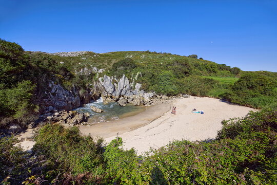 Playa Gulpiyuri Beach 100 m inland from the shore amidst green meadows, the seawater seeping through the karst rocks. Naves, Llanes-Asturias-073