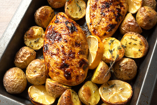 Oven roasted lemon garlic chicken and baby potatoes with herbs