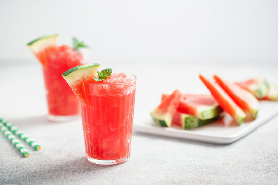 Refreshing cold summer drink watermelon slushie with mint in glass