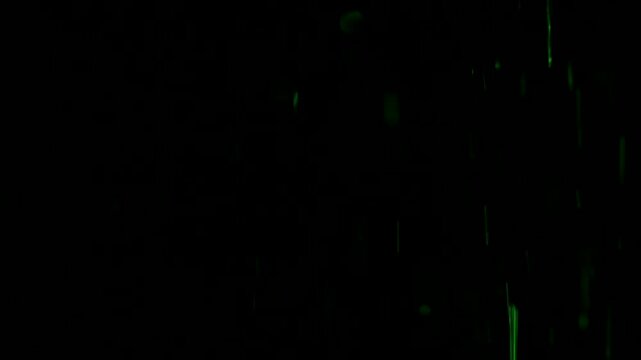 Tiny snow or dust randomly flying in the smoky air, empty space template for objects advertisement. Many dust particles cloud of white powder in colored light on empty dark black contrast background.
