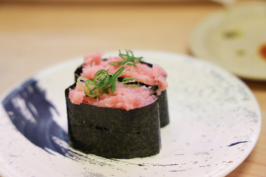 Japan April 29 2026 Tuna gunkan sushi topped with garnish