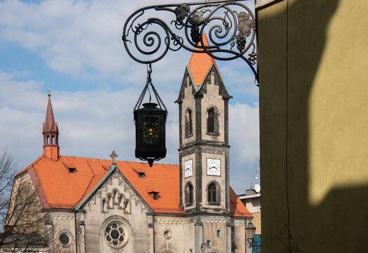 Vintage street lamp, Neo-Romanesque Protestant church in background, Church of the Savior (kości&oacute;ł Zbawiciela). Tarnowskie G&oacute;ry, Poland.