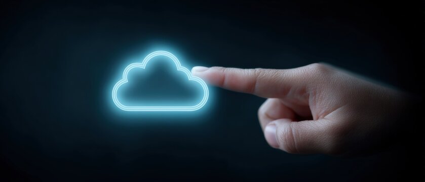 A hand extending towards a luminous cloud symbol representing cloud computing and digital technology illustrating the idea of data storage and connectivity in contemporary life