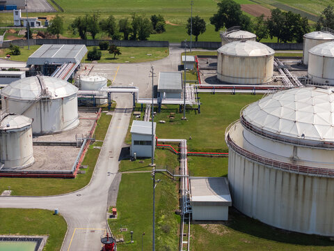 Aerial view of an oil storage facility with multiple tanks and pipelines. This site supports fuel storage operations.