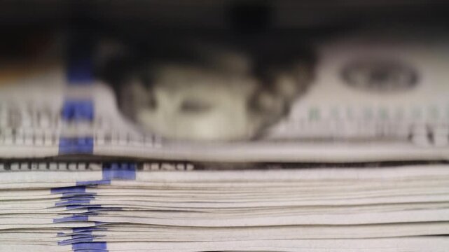 macro shot USD dollars cash deposit machine paper money calculation closeup currency