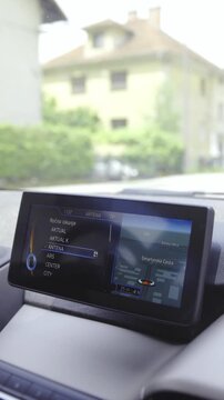 Futuristic car driving on road with GPS map showing path