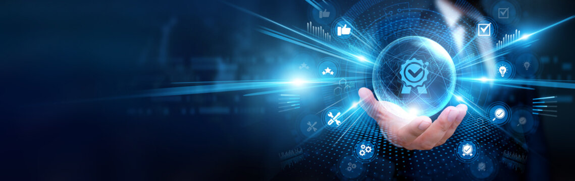 Businessman holding Quality Assurance and global standards, analyzing performance data, monitoring product quality, identifying defects, improving operational processes and reliability