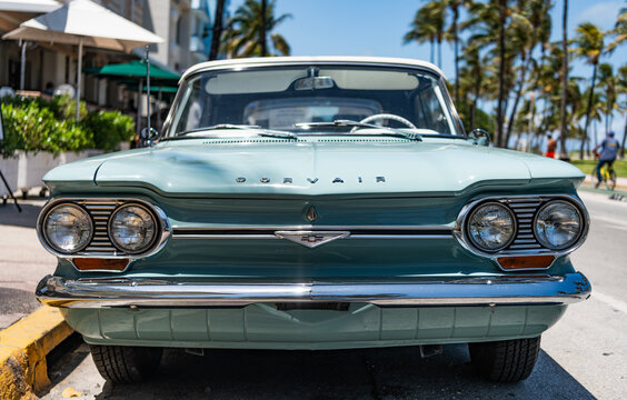 Miami, Florida, USA - May 06, 2025: Chevrolet Corvair 1964 convertible classic car. Luxury convertible car Chevrolet Corvair. Car Chevrolet Corvair parked outdoor. Blue Chevy retro car, front view.