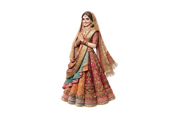 Fototapeta premium Indian woman in traditional embroidered lehenga choli with dupatta veil standing in namaste pose