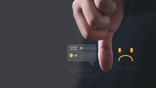 Customer review concept showing a low one-star rating, negative feedback and sad customer sentiment, with a hand interacting with a digital interface for business service evaluation.