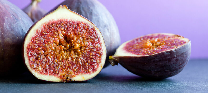 Ripe figs macro, whole and cut halves with seeds