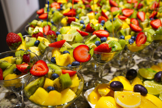 Assorted fruit salad cups at event candy bar, fresh dessert catering and sweet banquet concept