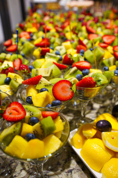 Assorted fruit salad cups at event candy bar, fresh dessert catering and sweet banquet concept