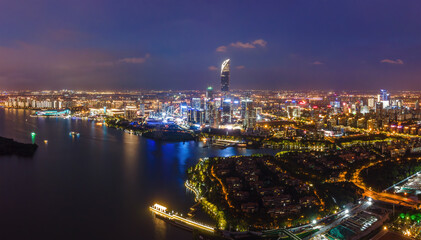 Fototapeta premium Aerial Night View of Modern City by Waterfront