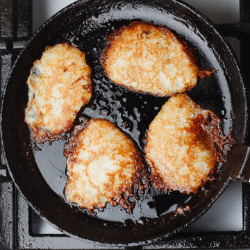Potato pancakes (Draniki) fried in cast iron skillet