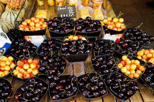 Fresh colorful cherries in a market in the Le Marais area of Paris