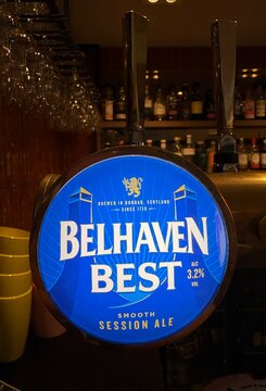Belhaven Best Scottish ale logo lens on a font in a cosy British Scottish pub setting