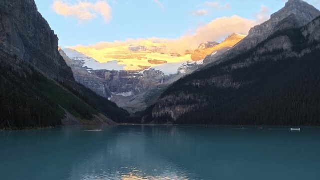Beautiful summer landscape at reflecting Lake Louise, Alberta, Canada with Rocky Mountains. Popular destination for travel, tourism, vacations, outdoor activities, trips, nature, adventure of Banff NP