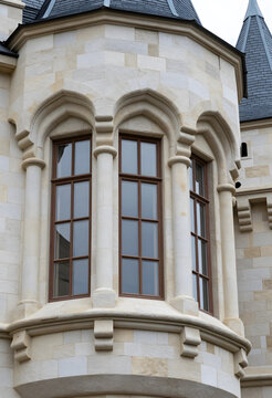 Heritage architecture and historic preservation, stone castle turret with gothic windows and masonry facade in a traditional european building style