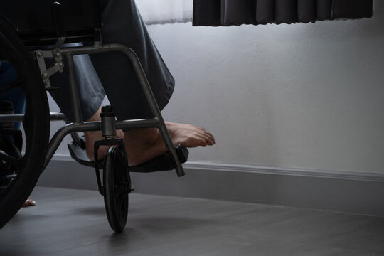Patient sitting in a wheelchair indoor. Medical care concept for handicap person mobility support and rehabilitation recovery health