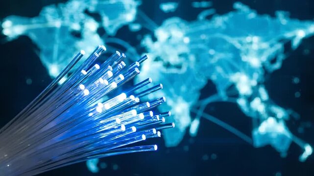 Glowing fiber optic cable transmitting high speed data over digital world map background in a global telecommunication network concept.