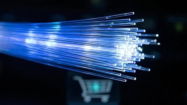 Blue fiber optic cables glowing with data transfer and a blurry shopping cart icon in the background, representing fast e-commerce technology