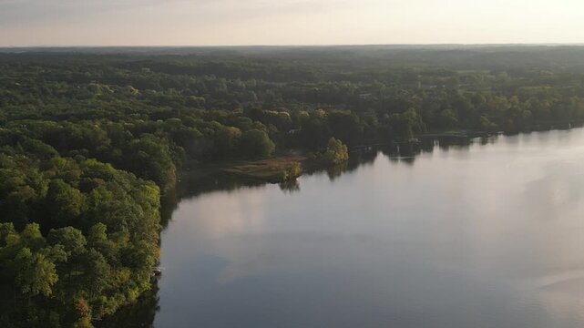 Lowering aerial over Lake Chapin, along the St. Joseph's River. Berrien Springs, in Berrien County, Oronoko Charter Township, Michigan, United States. A rural community.