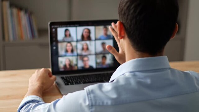 ?Engaged in virtual meeting: professional working on laptop