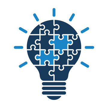 Light bulb puzzle solution icon representing creative innovation with puzzle pieces