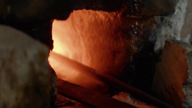 Glowing Forge Fire Heating Metal in Traditional Blacksmith Workshop