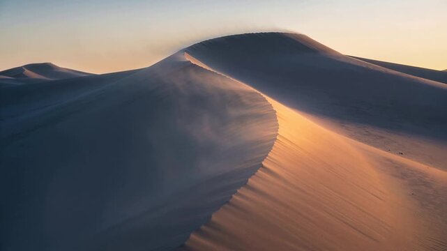 Blowing wind lifting sand plume along crescent-shaped dune ridge at desert, shaping ripples