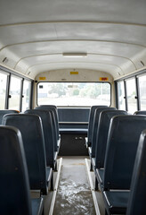 Obraz premium Public transportation and urban mobility, empty bus interior with rows of seats and aisle for daily commute and city travel in a passenger vehicle