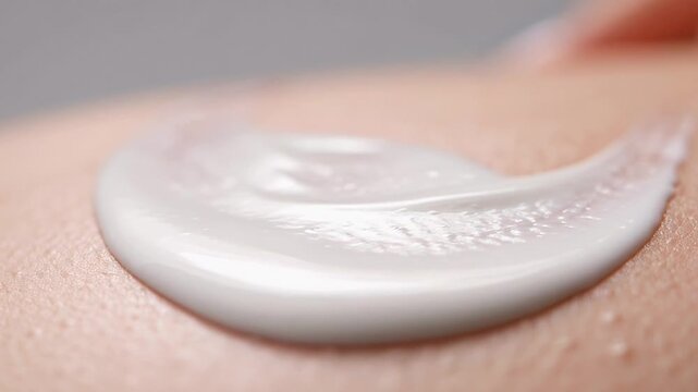 ?Applying moisturizing cream on skin: close up of smooth application technique