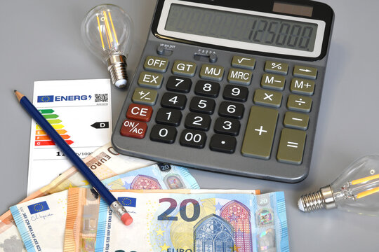 Calculating Home Energy Costs Concept with Calculator, Euro Money and Pencil