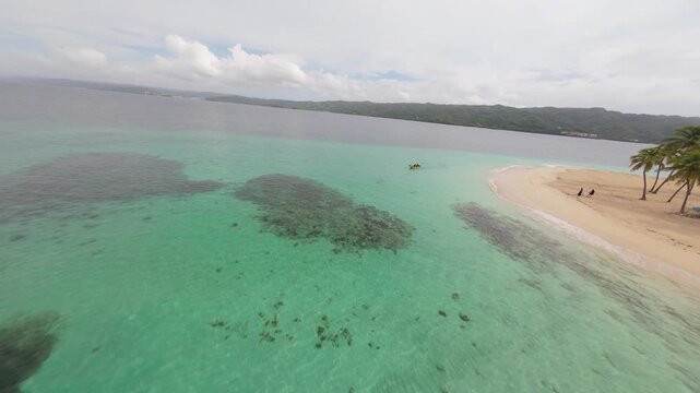 FPV Drone Flight Past Small Boat on Turquoise Water at Cayo Levantado Samana