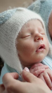 Newborn Twins In Owl Hats Sleeping During A Professional Photoshoot From A Top View. Vertical video