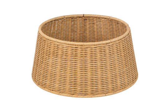 Empty natural wicker basket with a wide opening and tapered sides, crafted from light brown woven rattan on a white background