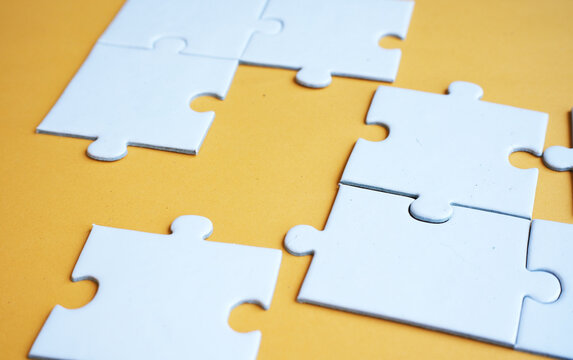 An incomplete puzzle, with some pieces missing, symbolizes incompleteness, imperfection, mystery, or loss. Concept of finding solutions and problem-solving.
